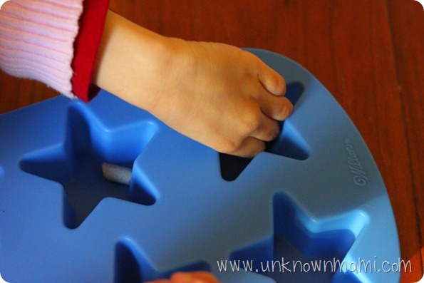 Filling silicone mold with crayons