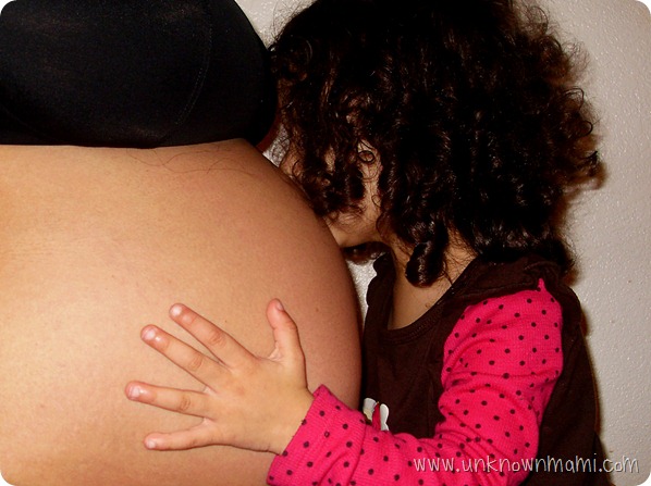 Kissing baby still in belly